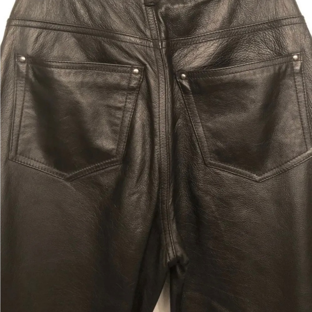 wilsons black real leather pants, lined.

Pockets on back pre-owned